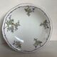 Old footed dish with gypsophila, white flowers.