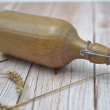 Small wooden sandstone bottle