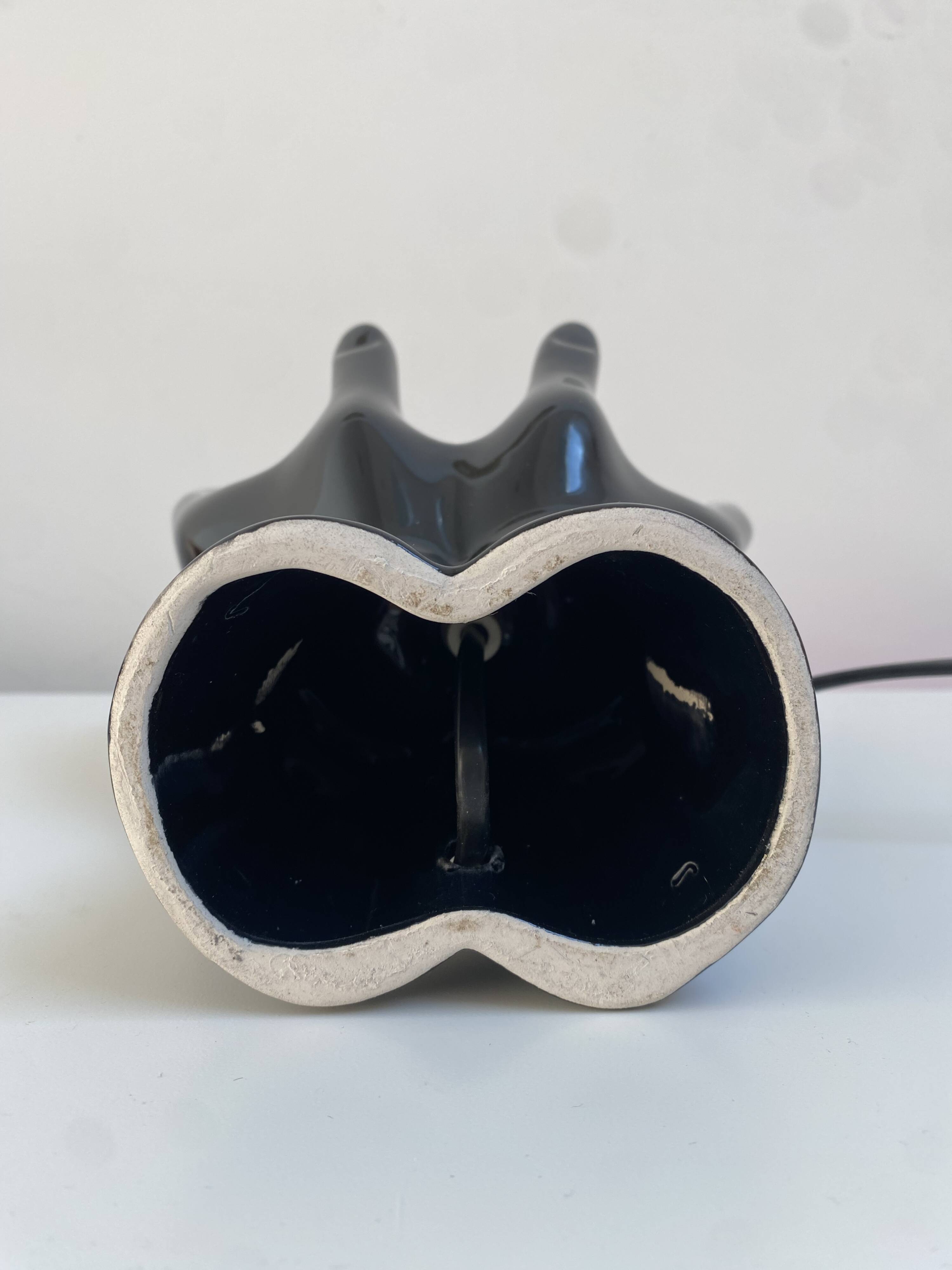 Sculpted ceramic globe lamp.