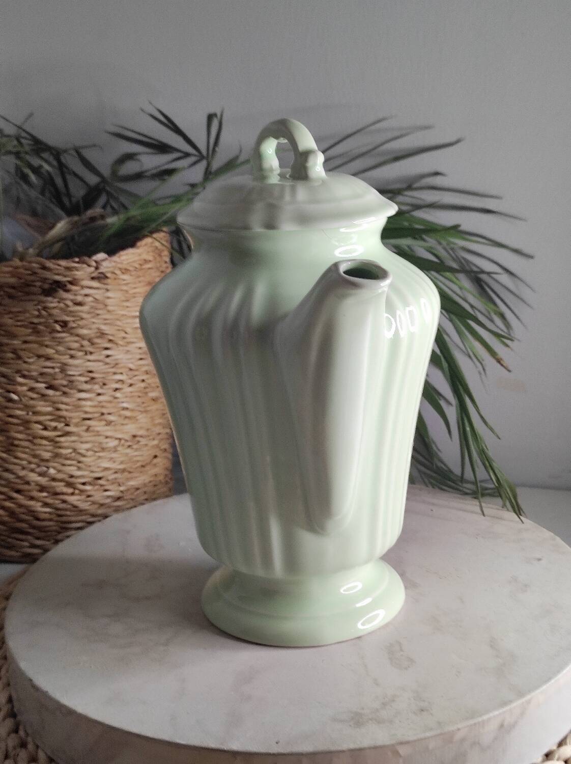 Green ceramic teapot