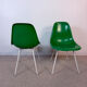 Eames Herman Miller chairs in green fiberglass.
