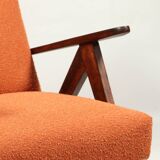 Vintage orange curly armchair Scandinavian design 1970