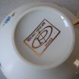 Old large tea cup and saucer in Limoges porcelain with flower decor