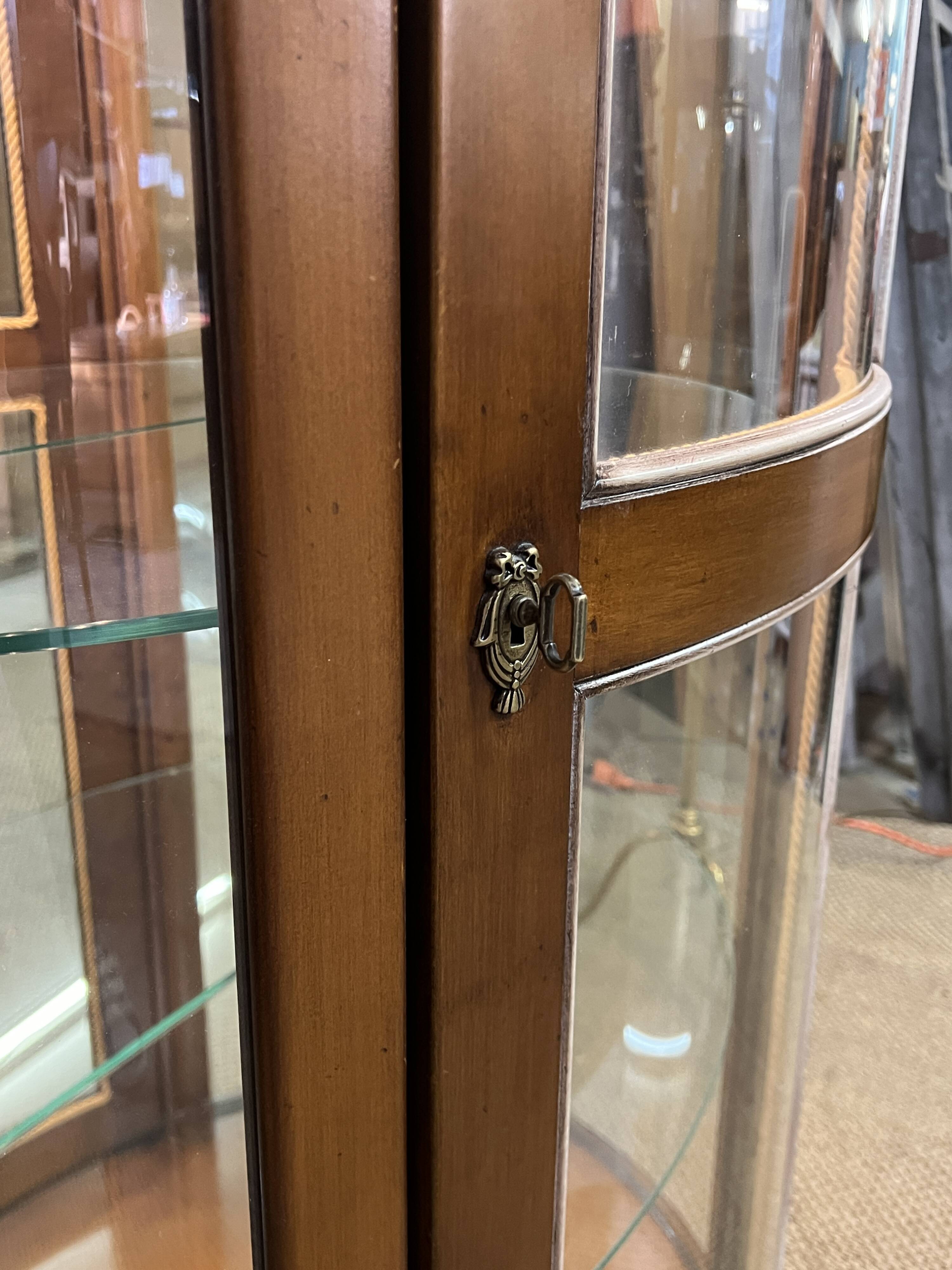Wooden display case and half-moon mirror