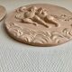 Pair of putti medallions