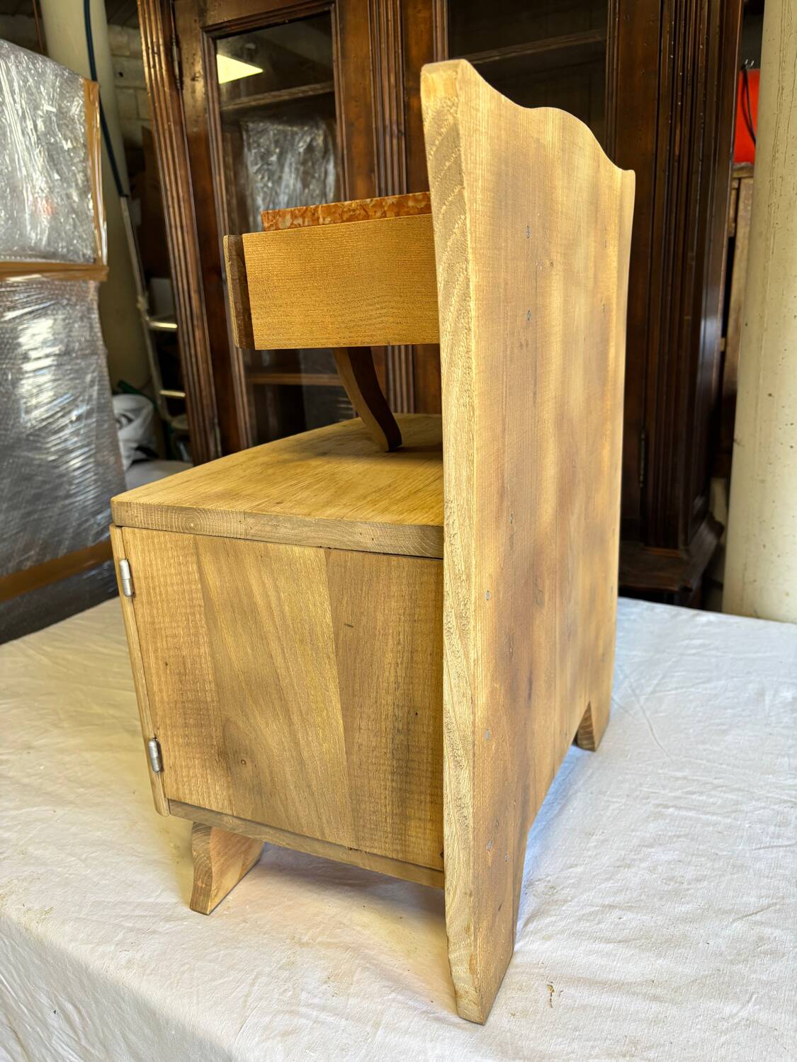 Raw wood bedside table