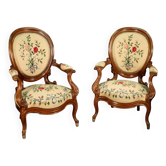 Pair of Louis Philippe armchairs with petit point upholstery.