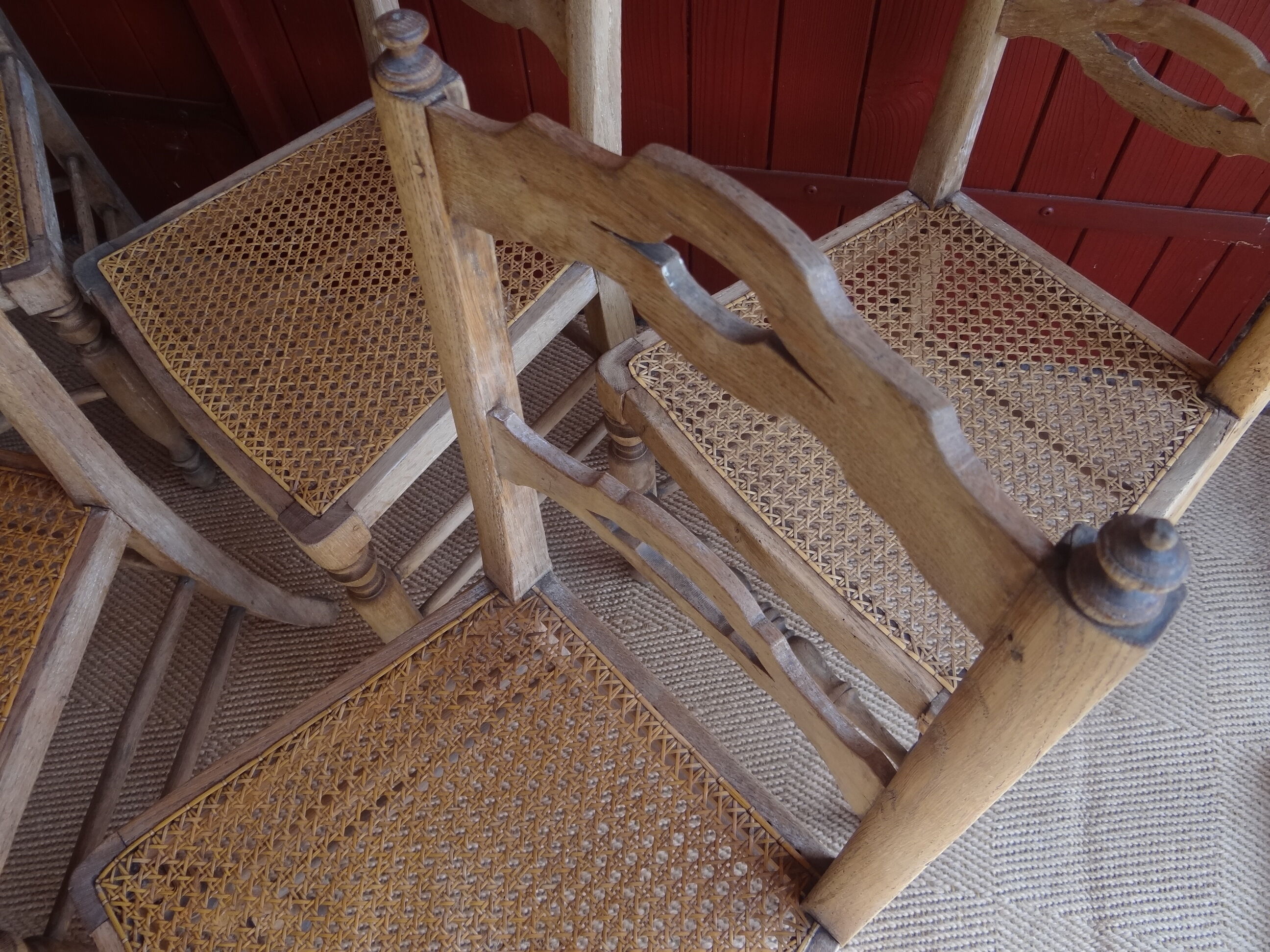 Suite of oak chairs; canated seats