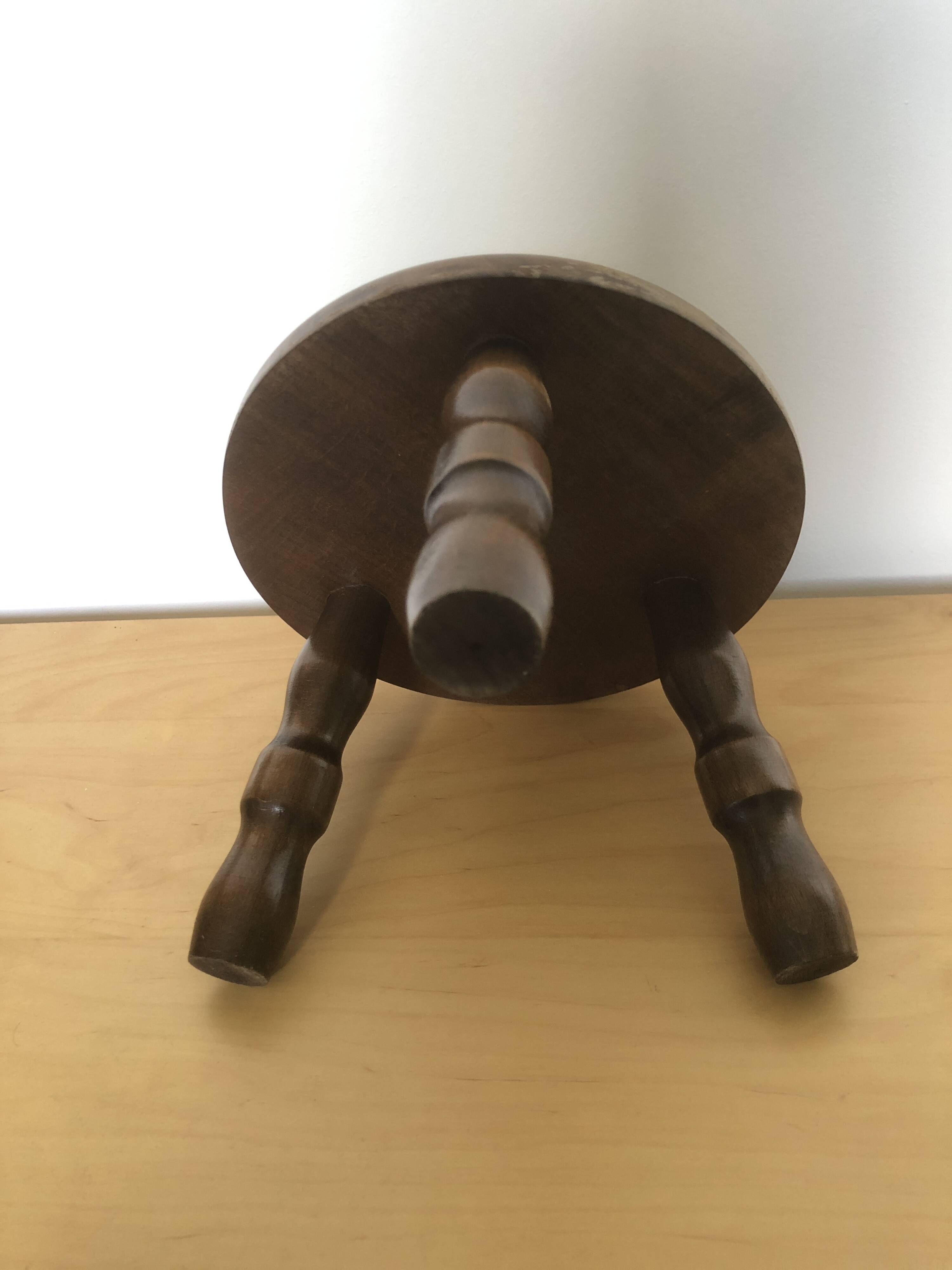 Low tripod stool in solid wood