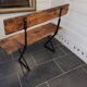 Old garden bench with iron legs and wooden seats