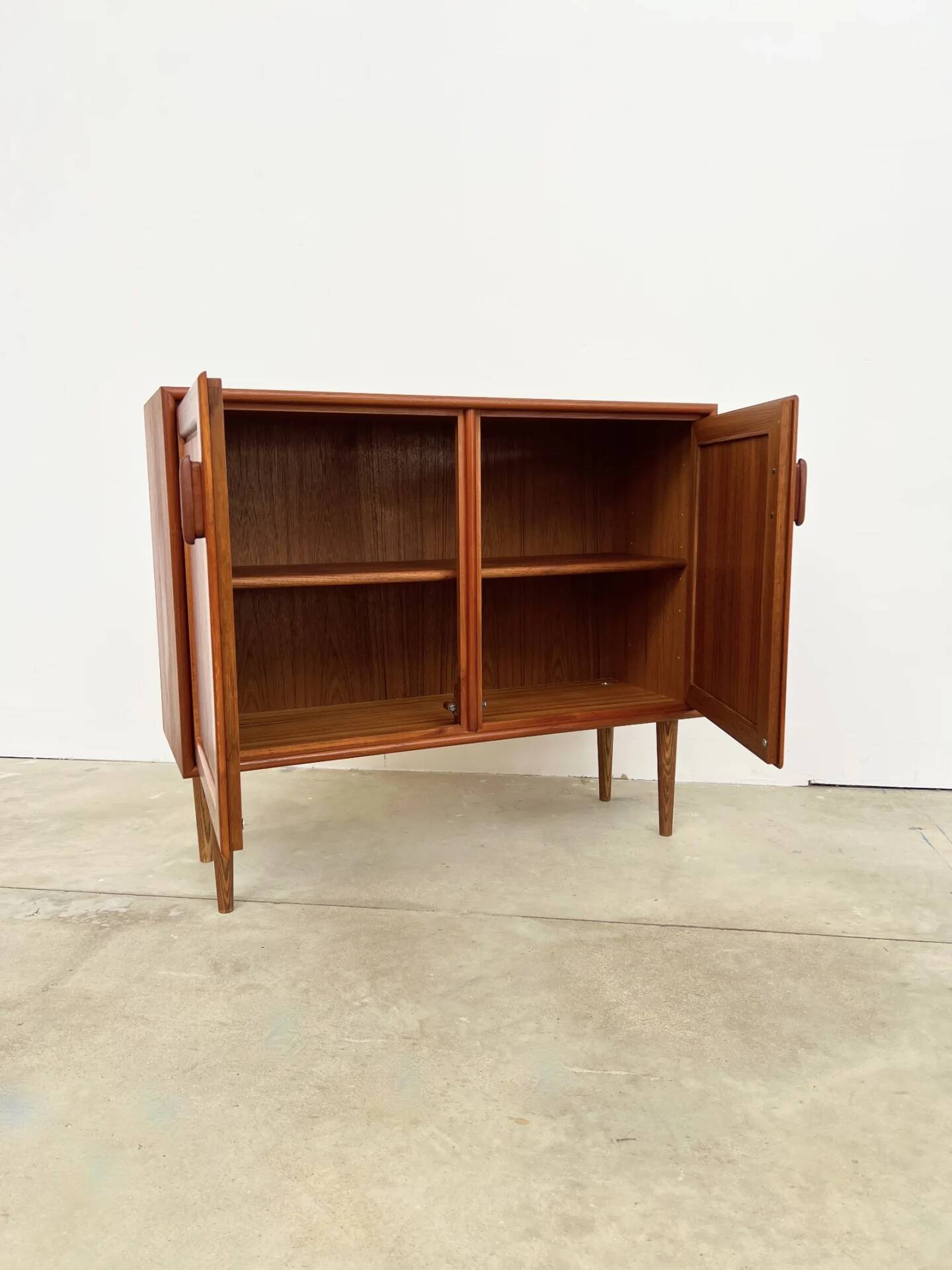 Small teak buffet with 2 doors, vintage Scandinavian style.