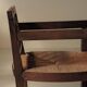 Handcrafted oak and straw armchair, France, circa 1950.