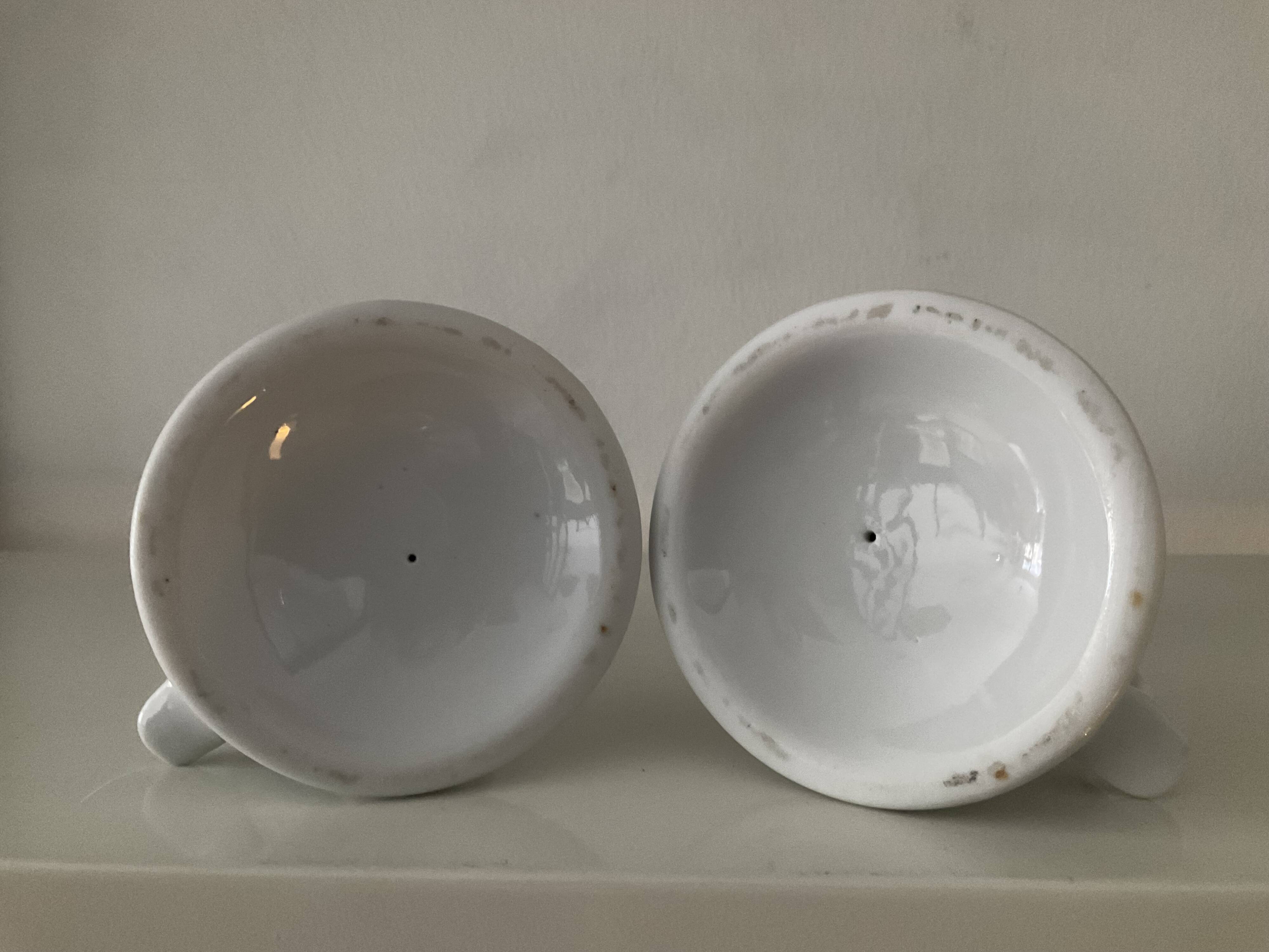 Pair of vintage cellar rat porcelain candlesticks