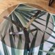Round coffee table in smoked glass and chrome