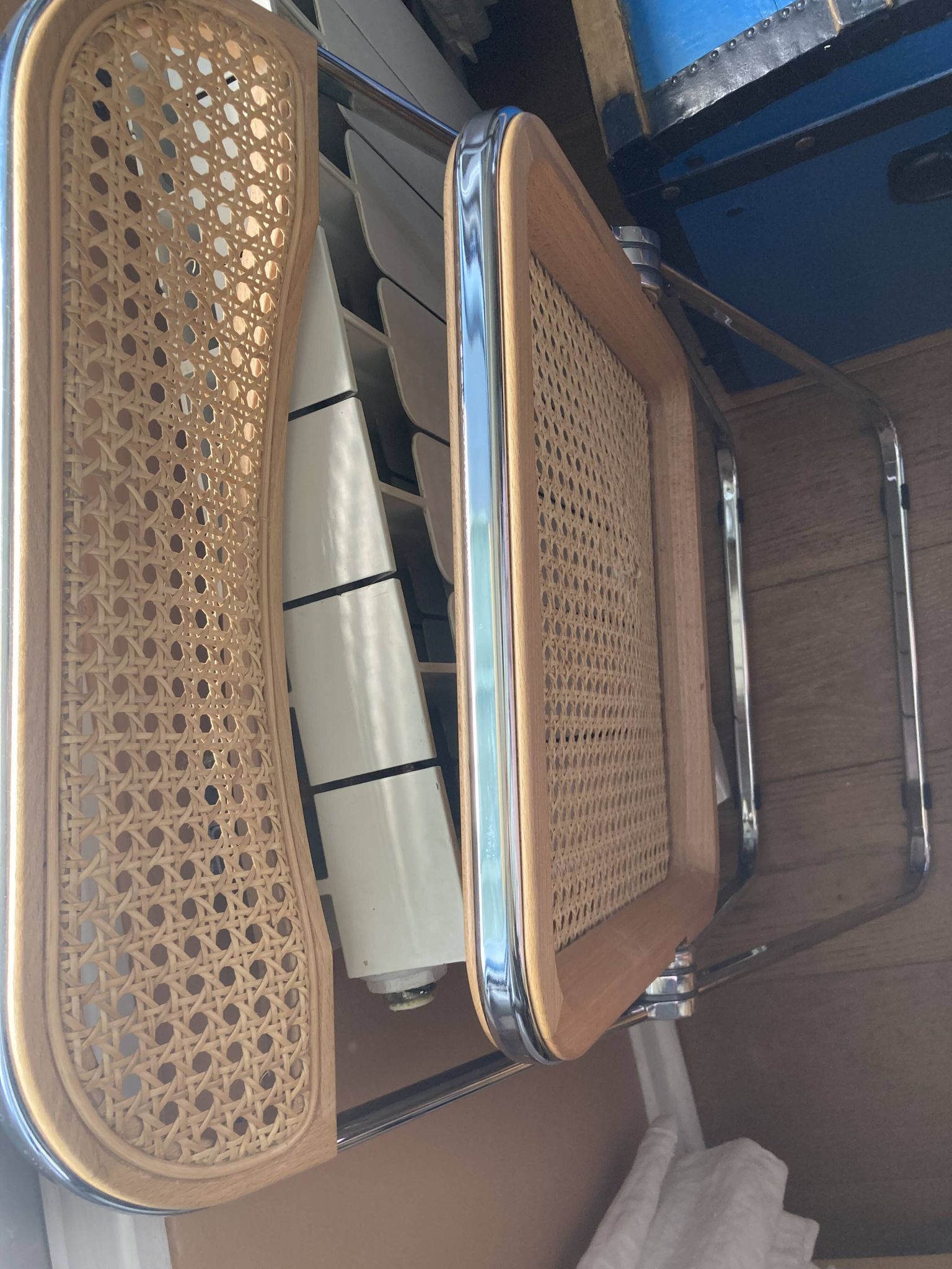 Plia chairs by Castelli in wood and cane.