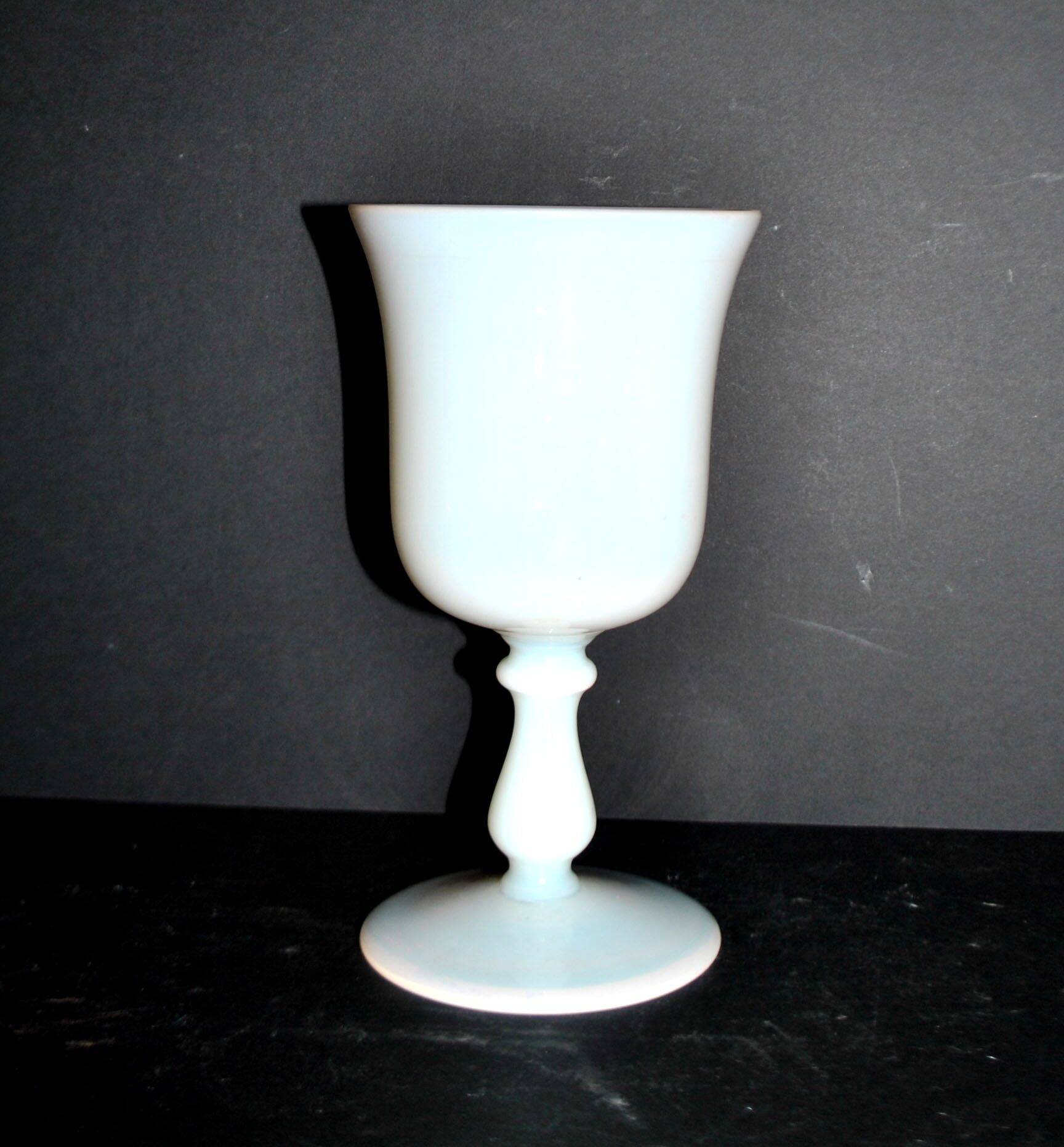 Ancient opaline white glass goblet with a soap bubble effect.