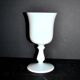 Ancient opaline white glass goblet with a soap bubble effect.