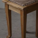 A pair of antique Danish pine stools from the late 19th century.