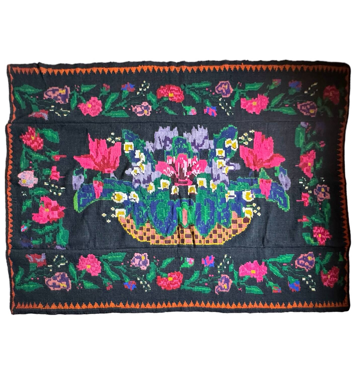 Romanian black wool carpet with a basket of colorful flowers