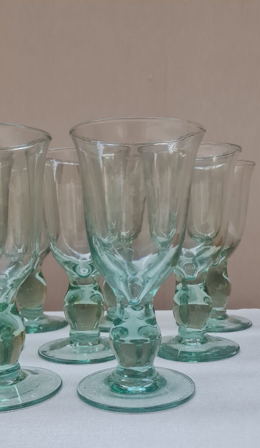 Service of 9 large blown glass stemmed glasses