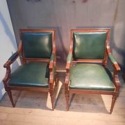 Pair of Louis XVI style armchairs upholstered in green leather.