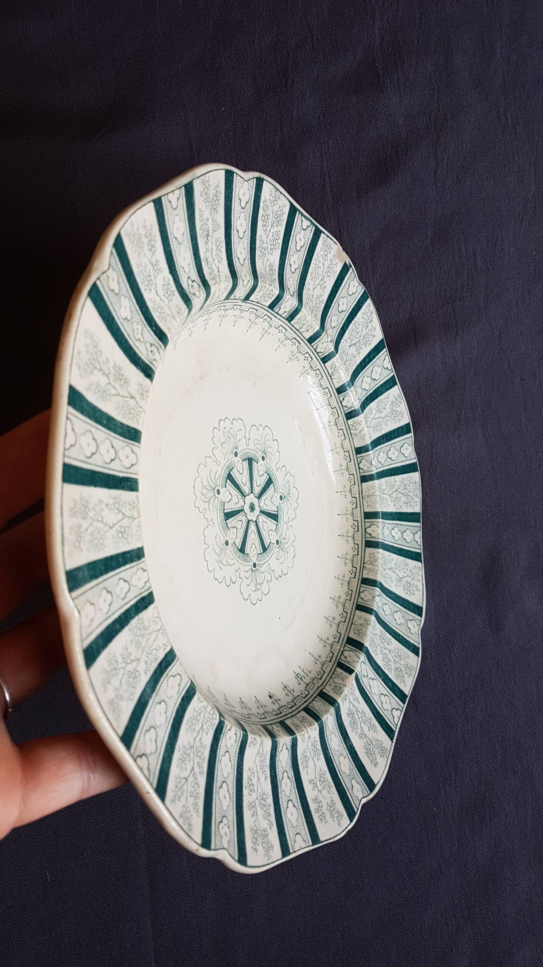 A plate made of earthenware decorated with flower crown