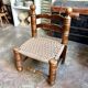 Low chair in dark wood and woven Danish cord attributed to Charles Dudouyt.
