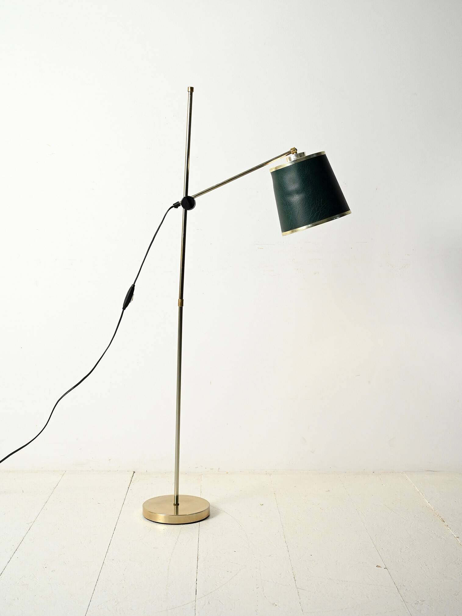 Brass floor lamp with green leather