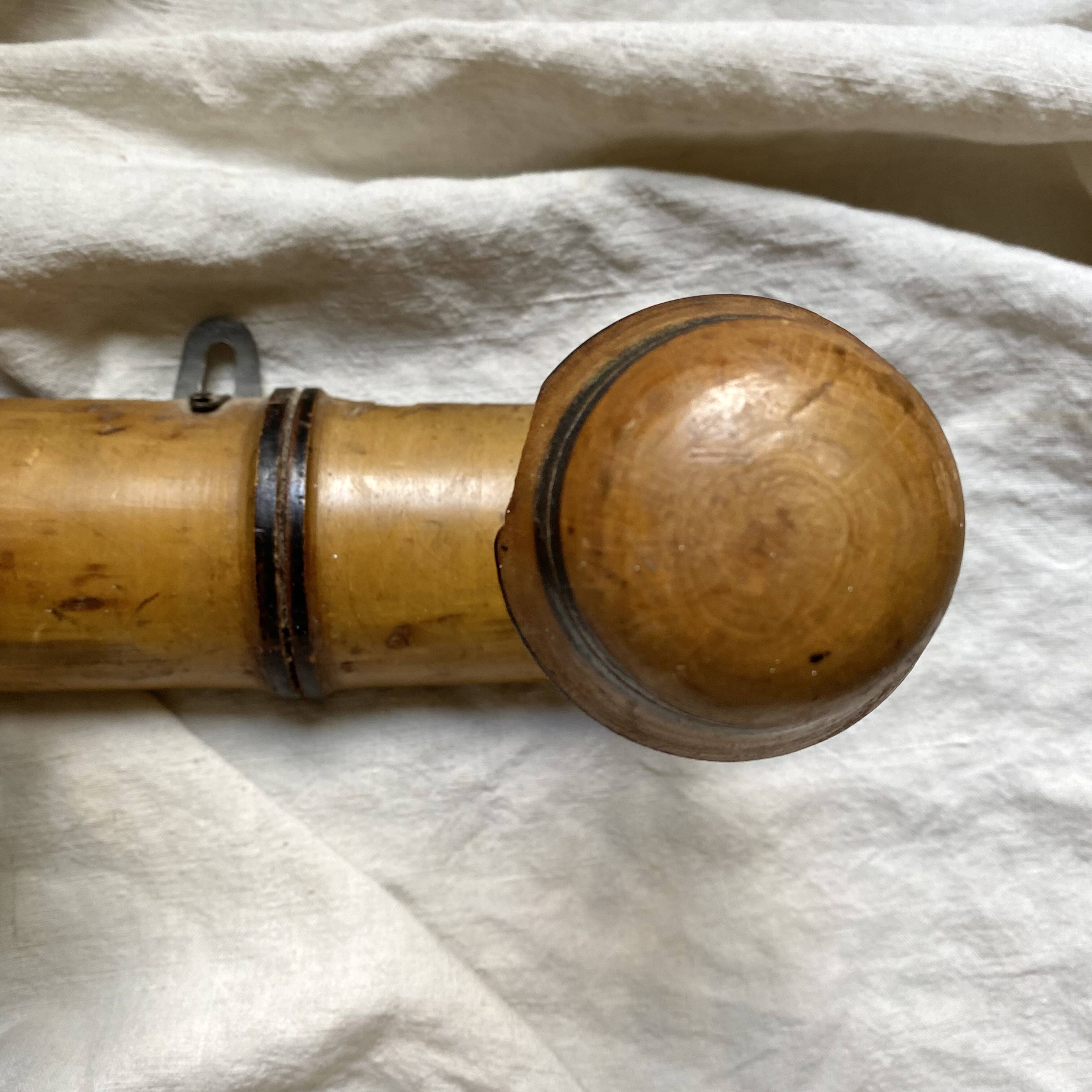 Antique wall-mounted coat rack in turned bamboo-style wood