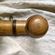 Antique wall-mounted coat rack in turned bamboo-style wood