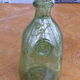 Biot stamped blown glass bottle