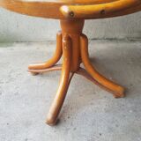 Swivel wooden armchair