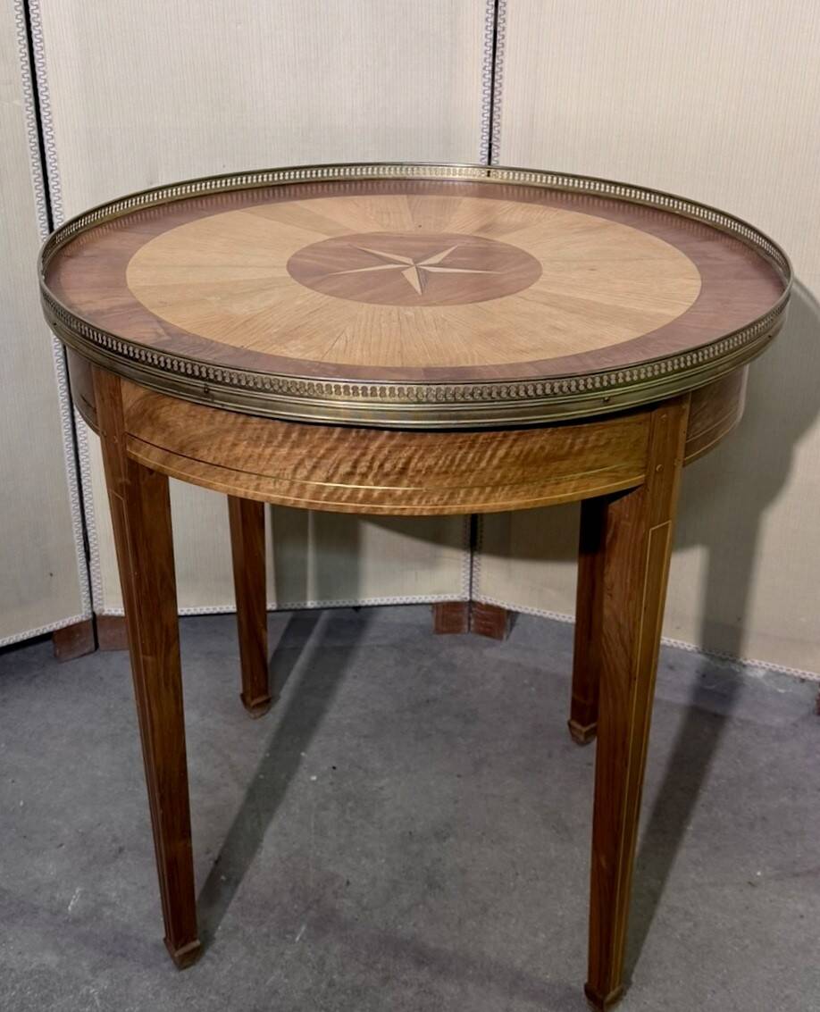 Bouillotte table in Louis XVI style with marquetry and gilded brass inlays.