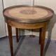 Bouillotte table in Louis XVI style with marquetry and gilded brass inlays.