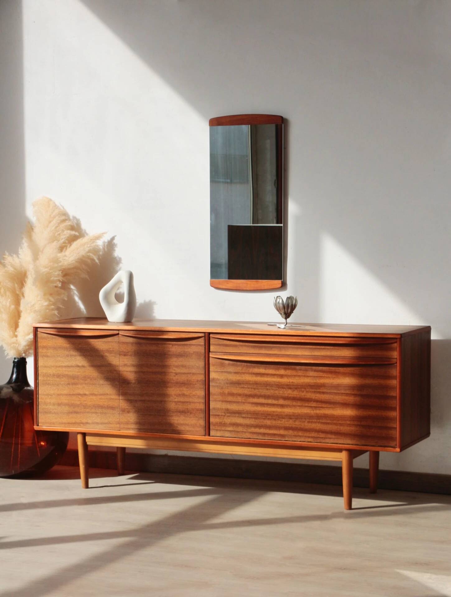 Vintage zebrano and walnut furniture from Morris of Glasgow.