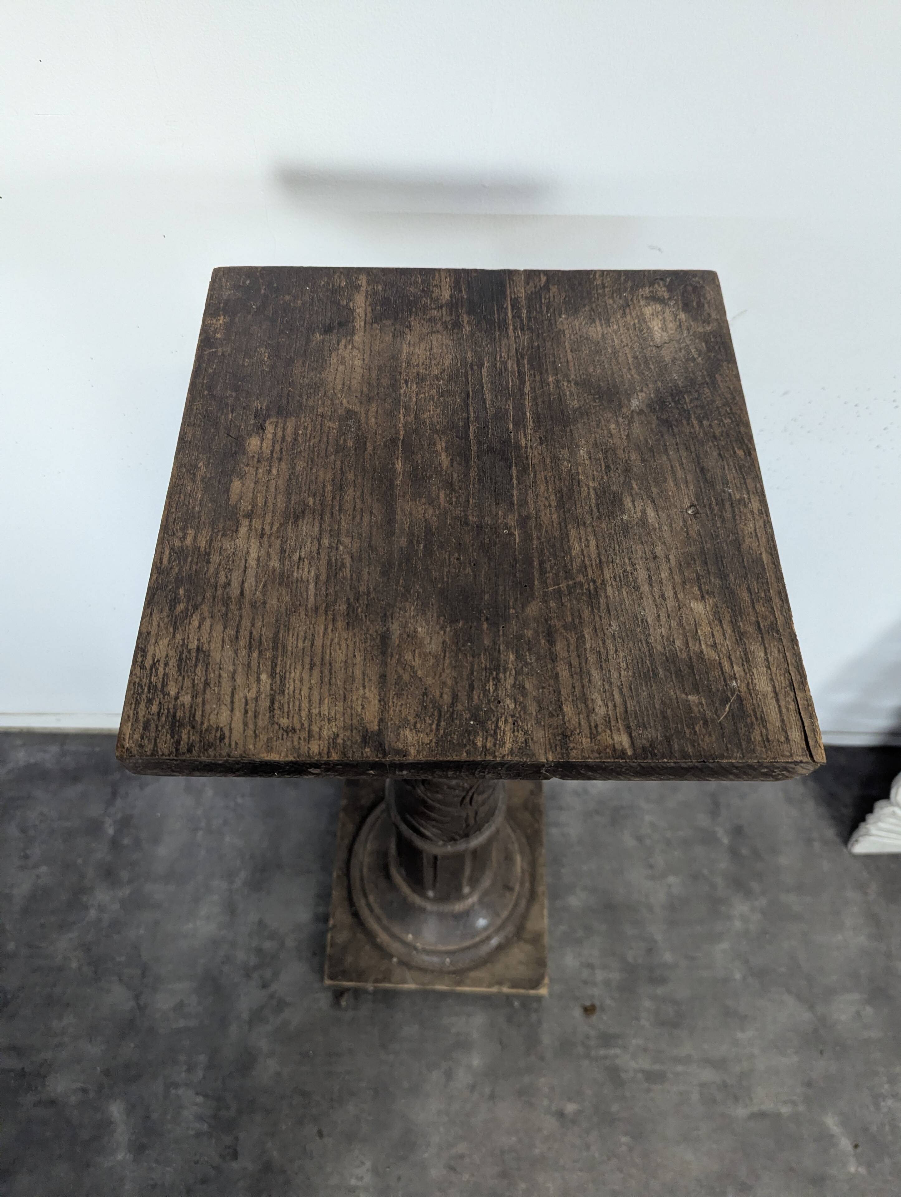 Fluted column side table in oak with a square top.