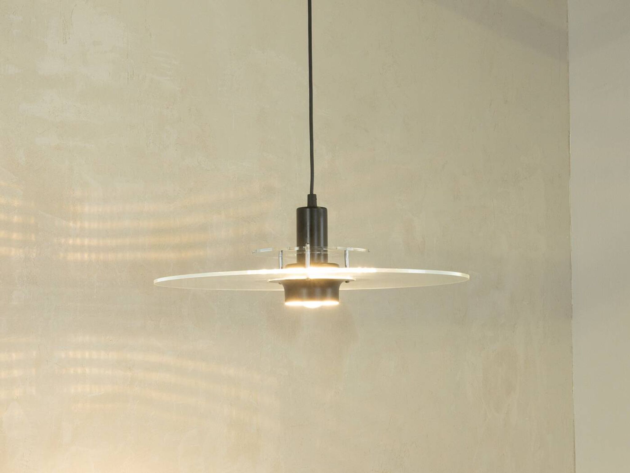 Space Age ceiling lamp by Ikea from the 1980s with two plexiglass plates and canopy made of black injection-moulded plastic.