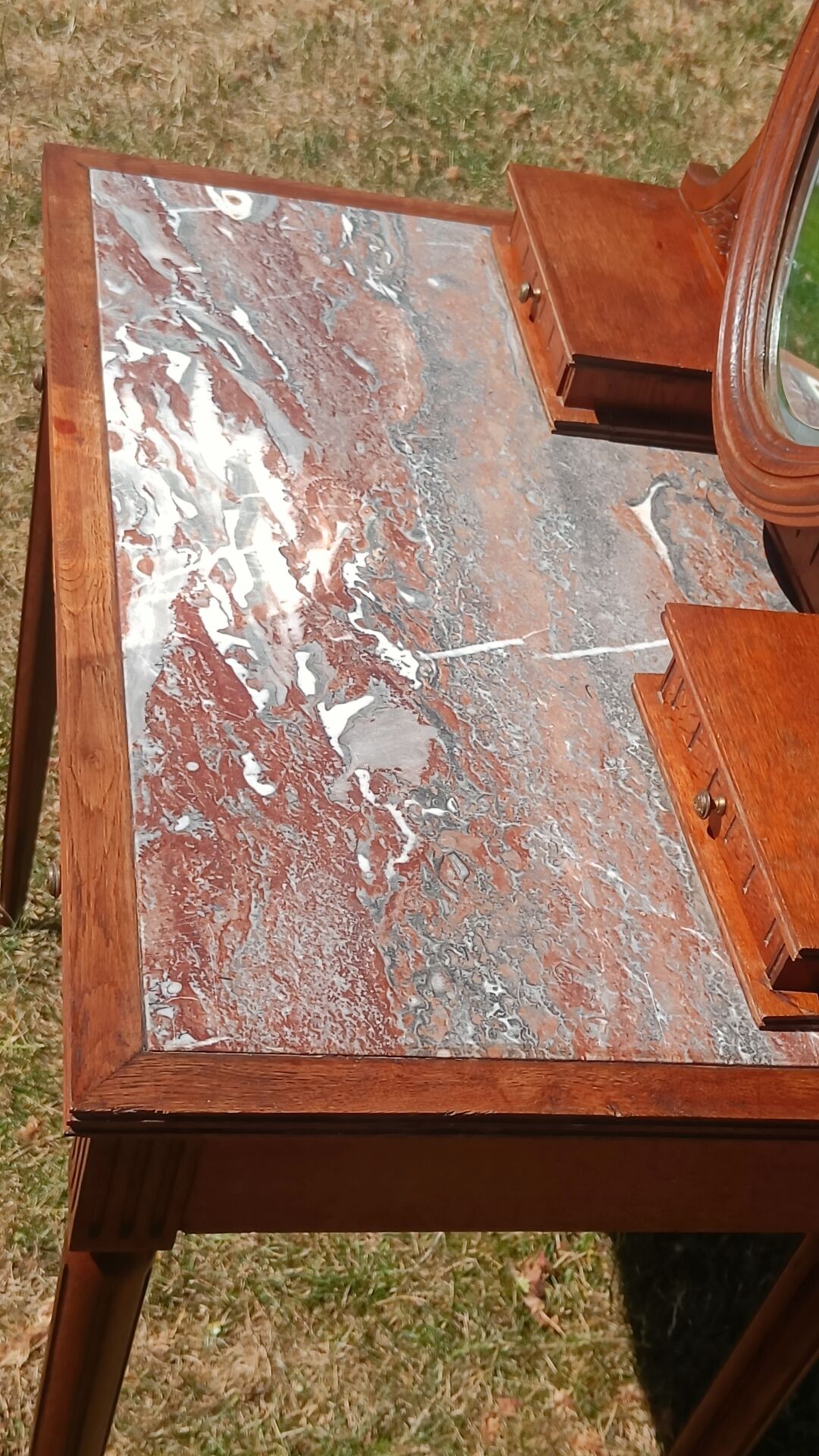 Art Deco oak dressing table, marble top and swivel mirror.