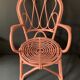 Vintage pink rattan armchair