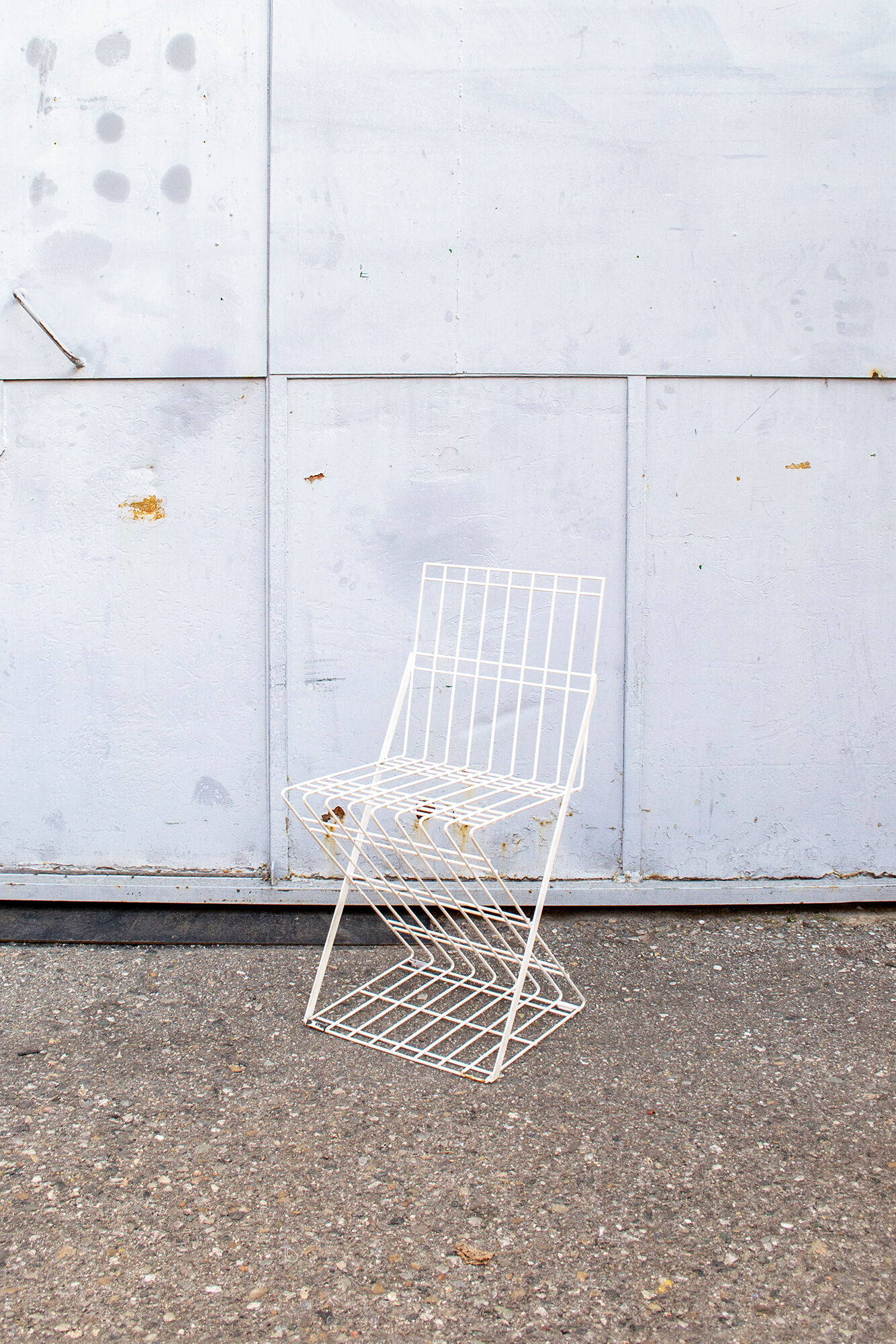 Stackable brutalist iron chairs Italy 70s