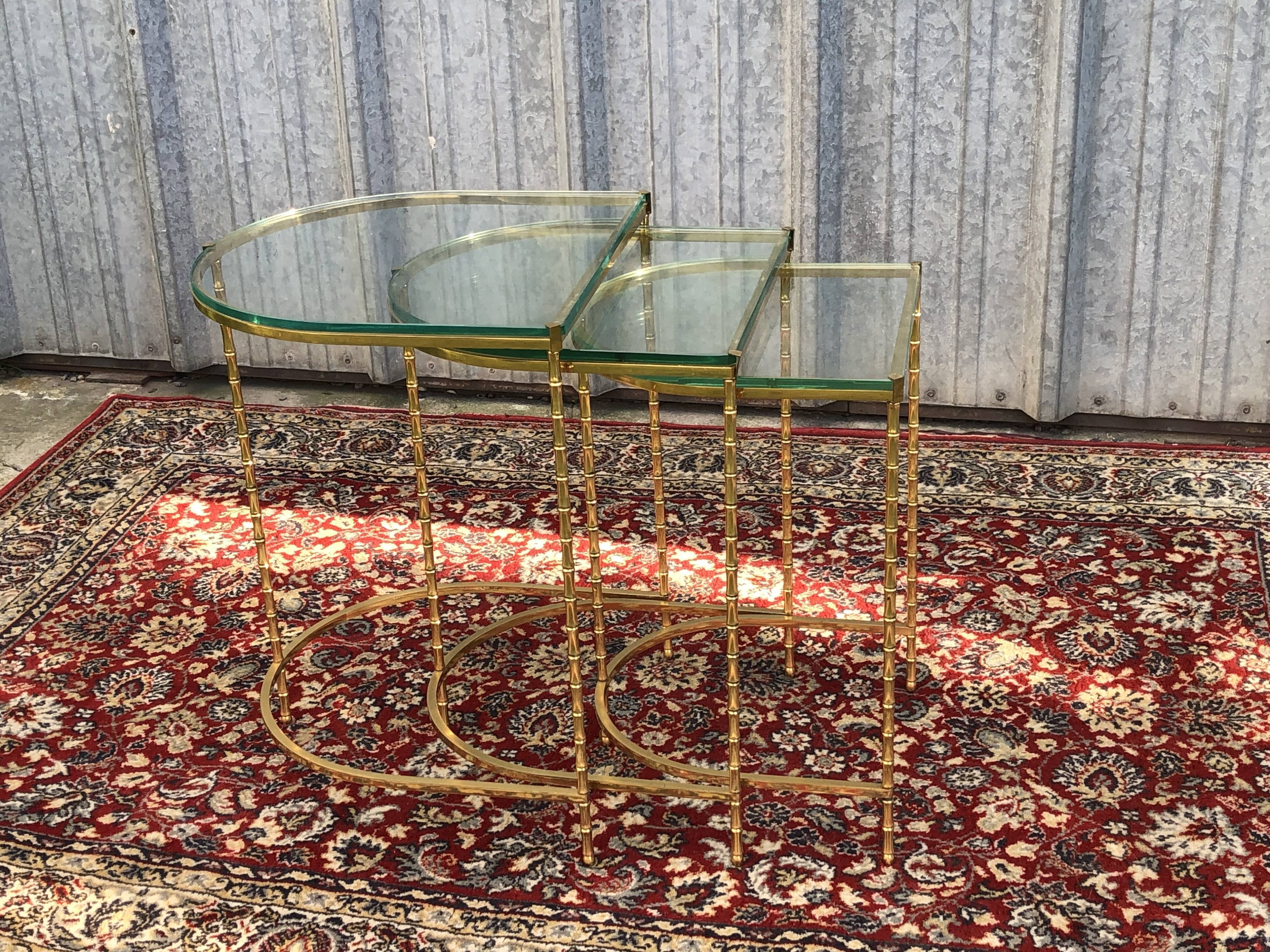 Suite of 3 trundle tables in golden brinze and glass slabs period 1970/1980
