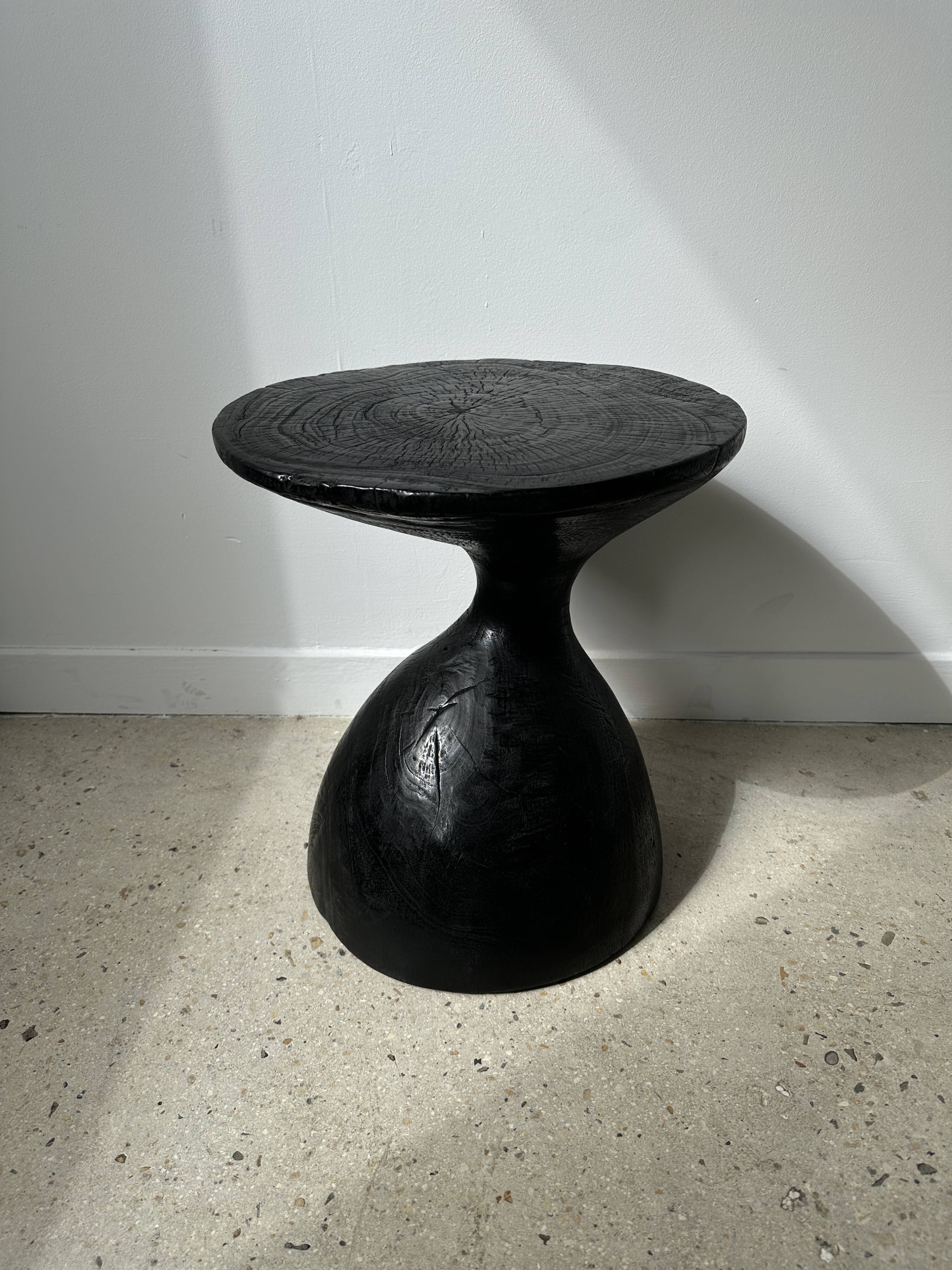 Solid wood (monoxyl) side table, organic shape, black color