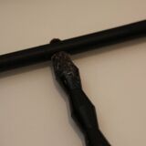 String shelf in wood and black metal
