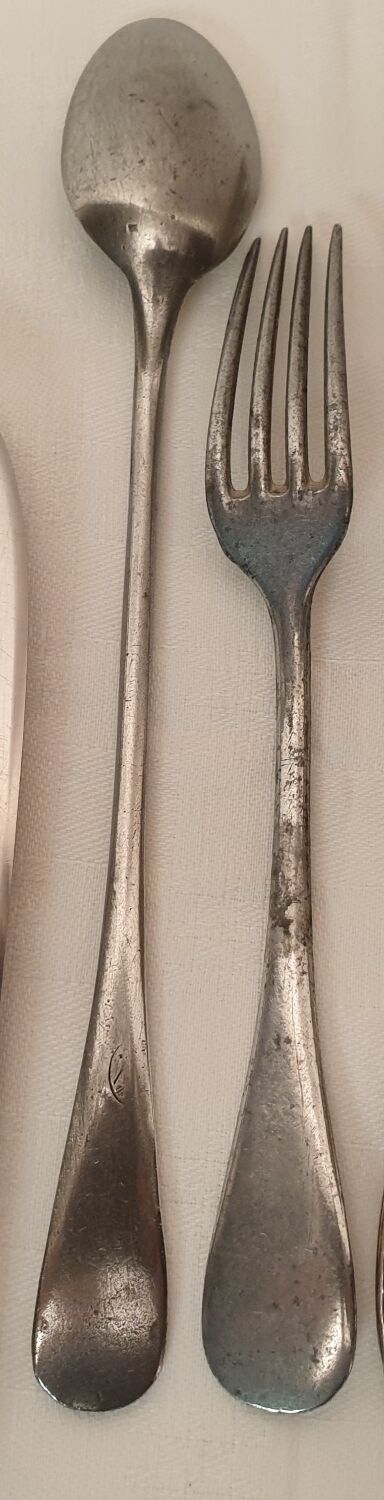 Set of mismatched silvered metal cutlery