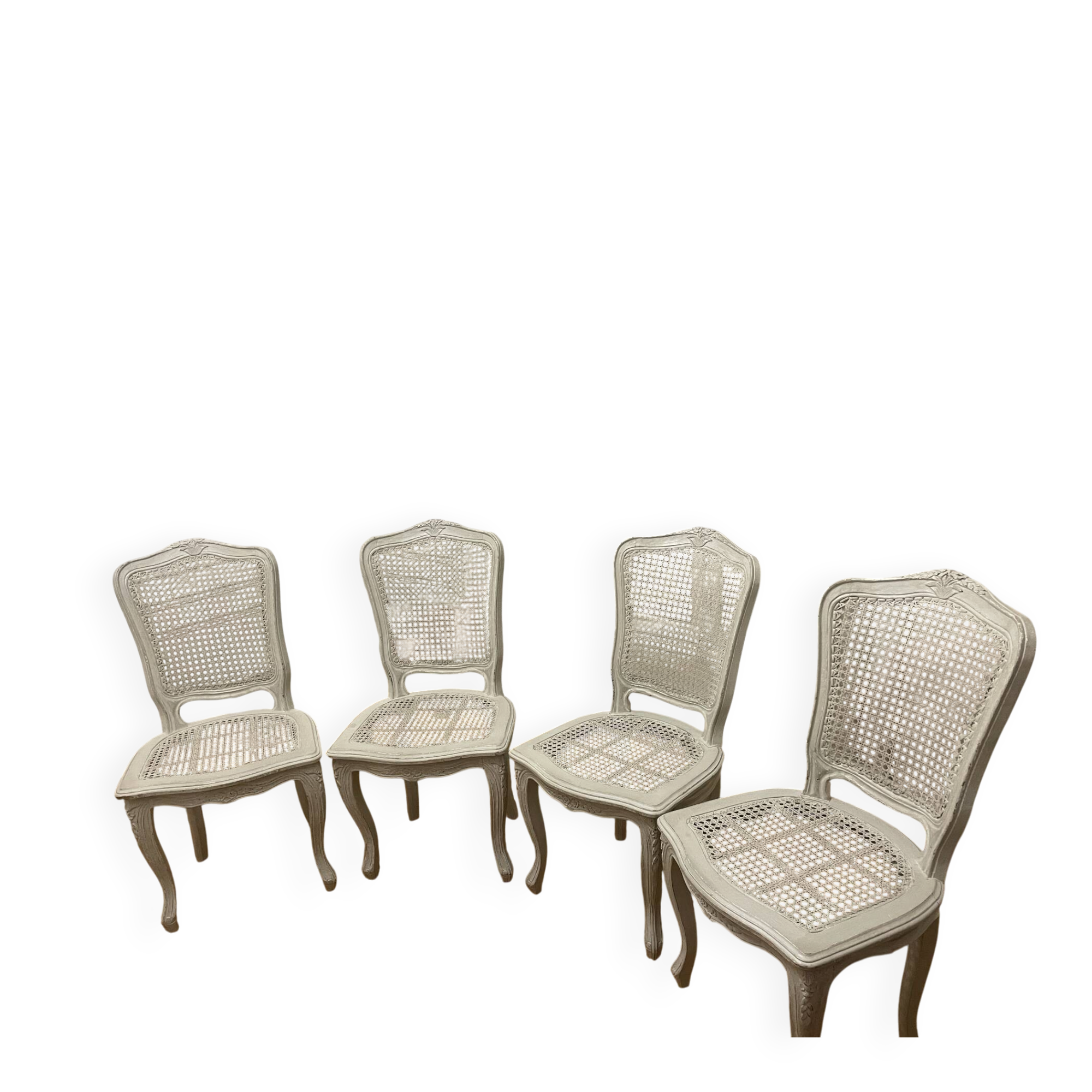 Set of 4 white caned chairs in Louis XV style.