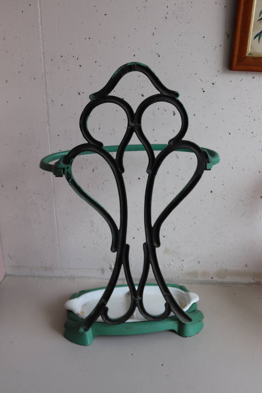 Old green cast iron umbrella stand