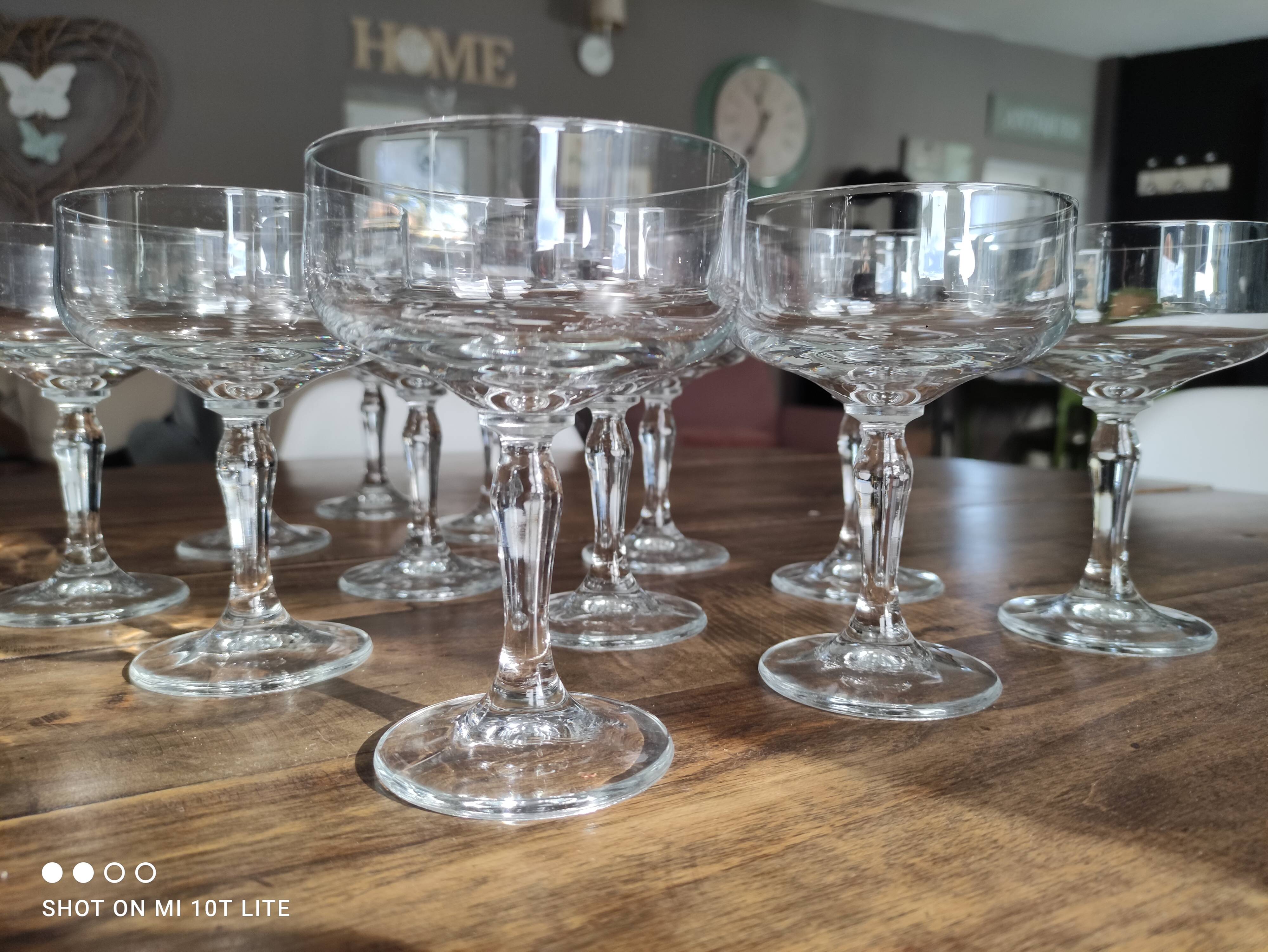 Set of 12 vintage glass champagne glasses with curved foot