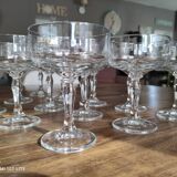 Set of 12 vintage glass champagne glasses with curved foot