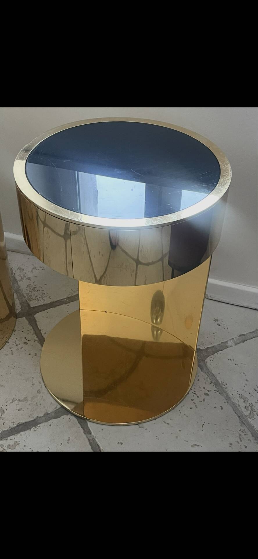 2 bedside tables and a brass Fendi table.