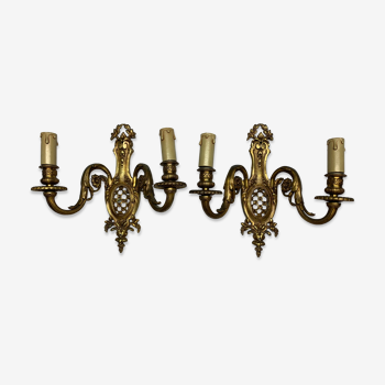 Pair of classic wall lamps in gilded bronze
